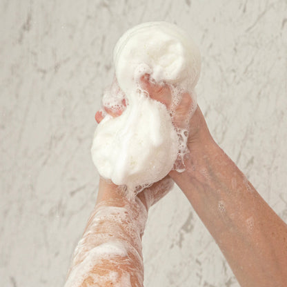 Person holding a shower sleep remedy for insomnia 